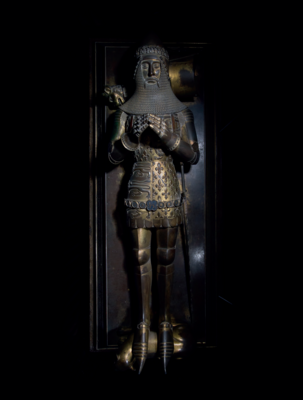 The effigy of the Black Prince on his tomb. c.1386. Gilded brass, with silvered and enamel details. (Trinity Chapel, Canterbury Cathedral; photograph by kind permission of Canterbury Cathedral).